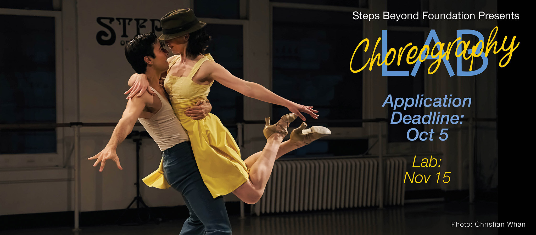 A male and female dancer on stage at Steps Studio Theater, she is in yellow and leaping into his arms.